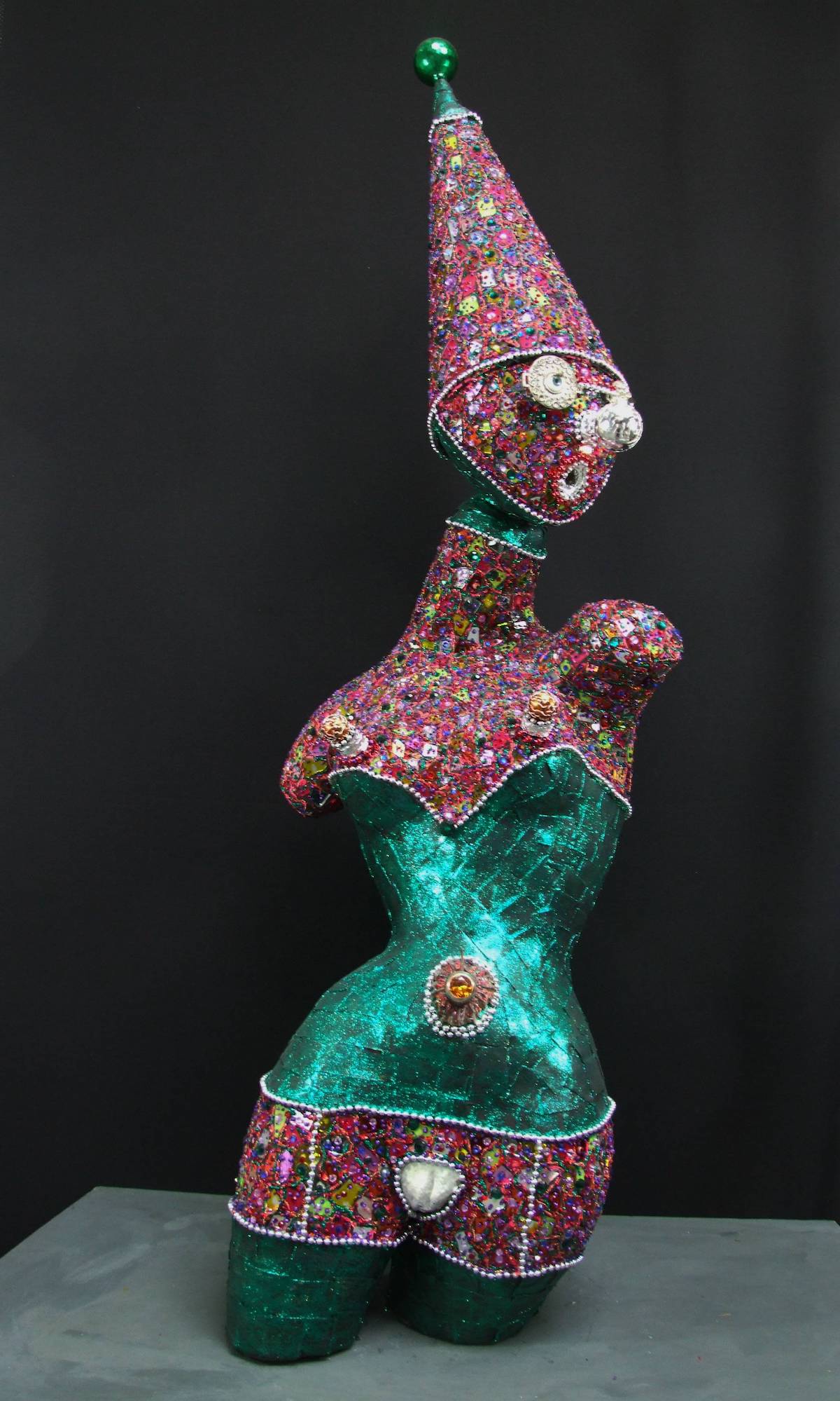 " CELEBRITY # 2 " from the series, ' Girls on Tour ( who haven't yet toured ).....' Medium Mixed Media ------ after creating her shape, I dressed " Celebrity #2 " in layers of mosaic, thinly rolled treated lead, glitter paint, diamante, found objects plus some inspiration..... Size Life Size